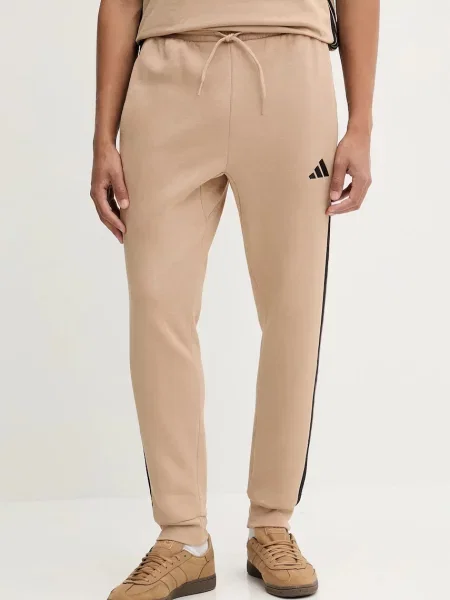 Спортивні штани adidas Essentials з аплікацією бежевий