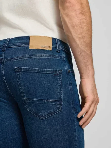 Jeansy o kroju slim fit z 5 kieszeni Mcneal granatowe
