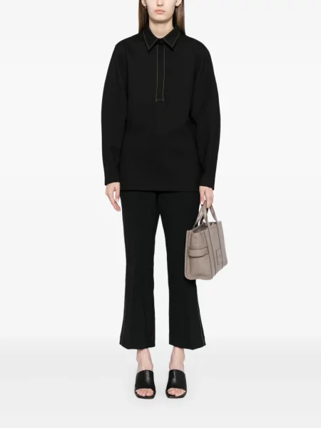 Kelnės Victoria Beckham įsiliepsnojo juoda