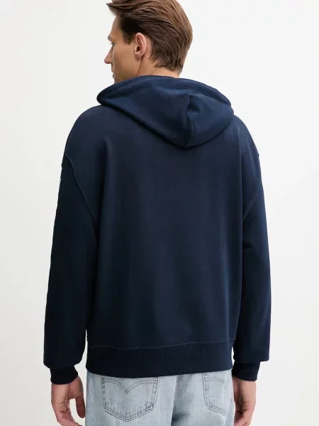 Bombažen pulover Tommy Jeans mornarsko s kapuco modra