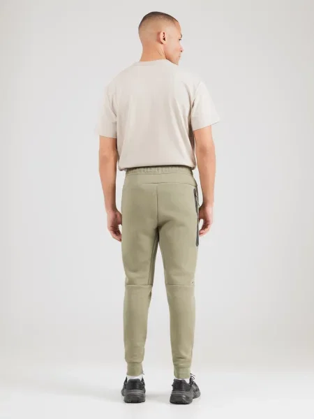 Nike Sportswear Nohavice TCH FLC pastelovo zelená