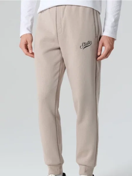 Sinsay Spodnie dresowe jogger beżowy