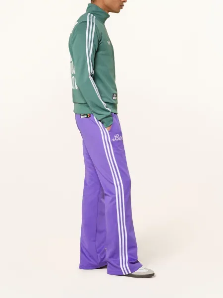 Sportovní kalhoty Adidas fialový