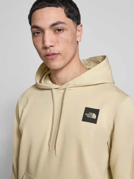 Bluza z kapturem o kroju regular fit z nadrukiem z logo The North Face beżowa