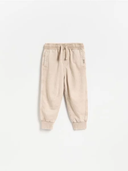 Reserved Pantaloni cu efect prespălat bej