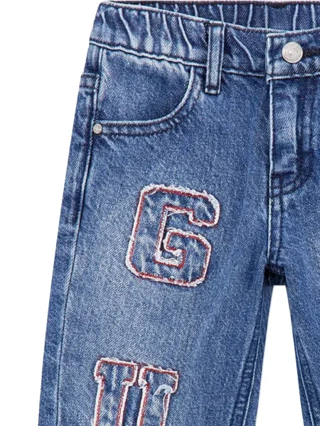Jeansy dziecięce Guess niebieskie