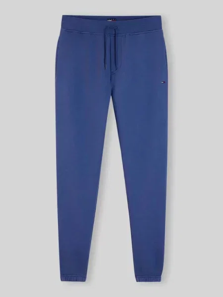 Spodnie dresowe o kroju slim fit z mieszanki bawełny Tommy Jeans granatowe