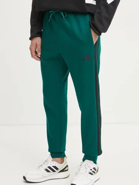 Donji dio trenirke adidas Essentials s uzorkom zelena