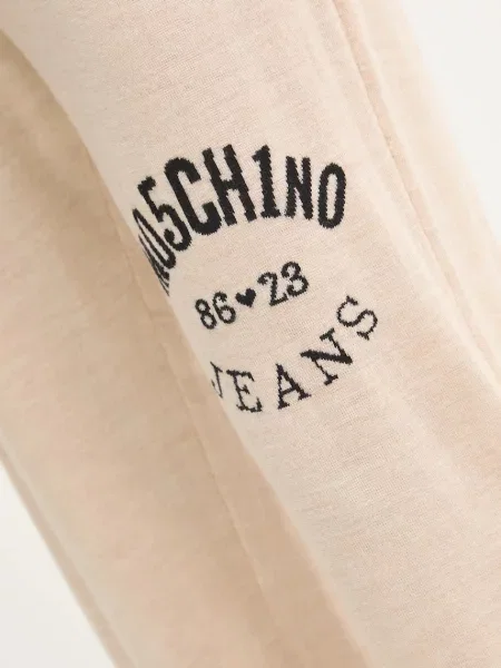 Шерстяные брюки Moschino Jeans с аппликацией бежевые