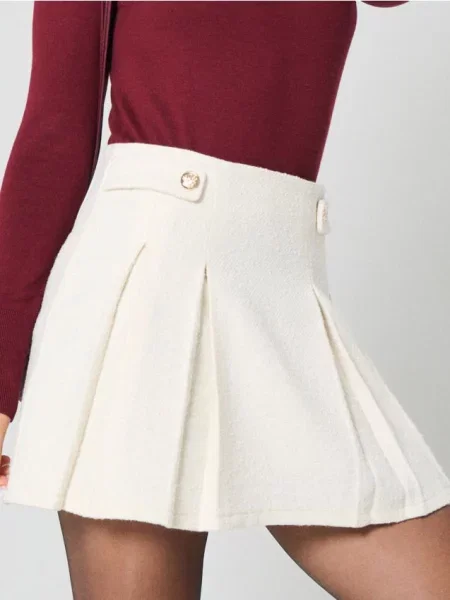 Міні спідниця зі складками кремовий