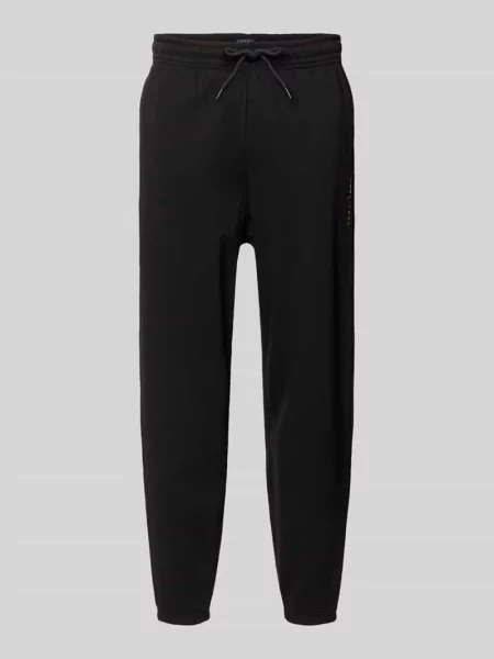 Spodnie dresowe o kroju regular fit z mieszanki bawełny Tommy Jeans czarny