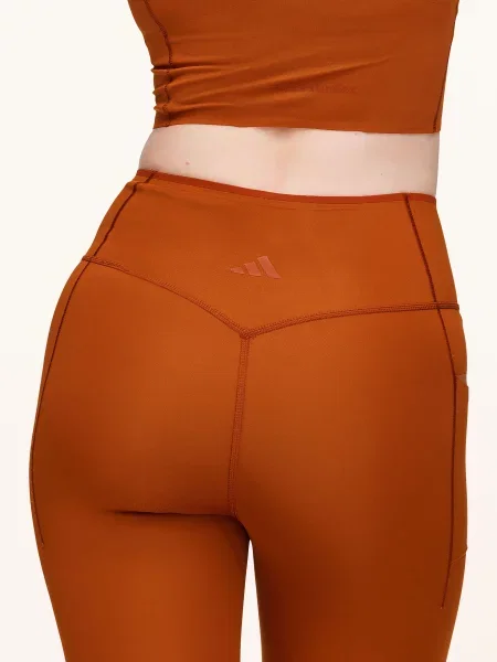 Adidas Legíny Adidas X Entire Studios Essentials Optime tmavě oranžová