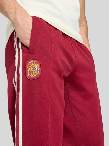 Spodnie dresowe w kroju regular fit z dodatkiem bawełny Adidas Originals bordowy