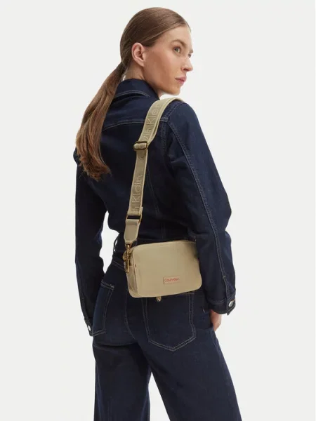 Calvin Klein Kabelka Webbing Strap Canvas Camera Bag béžová