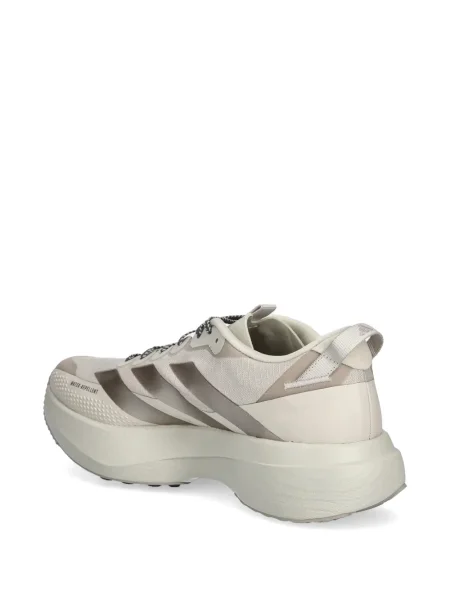 Sneakersy Adidas Predator w paski z dekoltem w serek z kapturem różowe