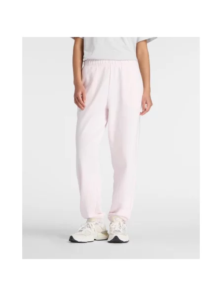 Spodnie długie New Balance Sport Essentials French Terry Jogger jasne XS różowe