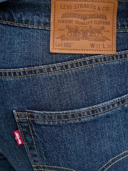 Blugi evazați Levi's® din piele de căprioară albastru