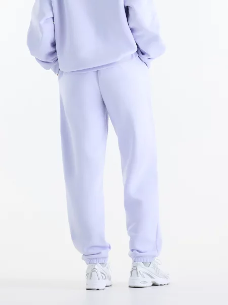Спортивні штани New Balance Sport Essentials Fleece бавовна/поліестер фіолетовий