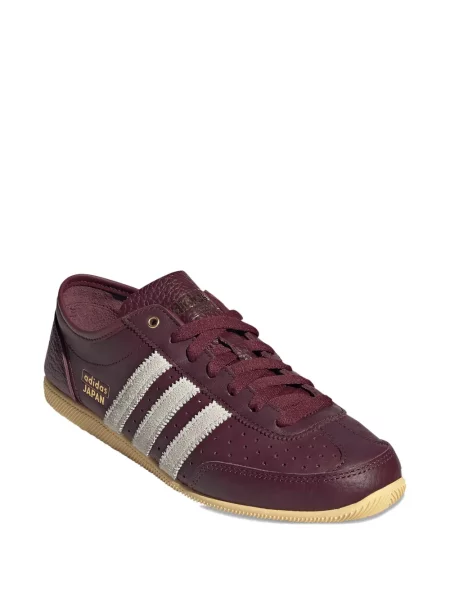 Pantaloni Adidas cu dungi din piele roșu