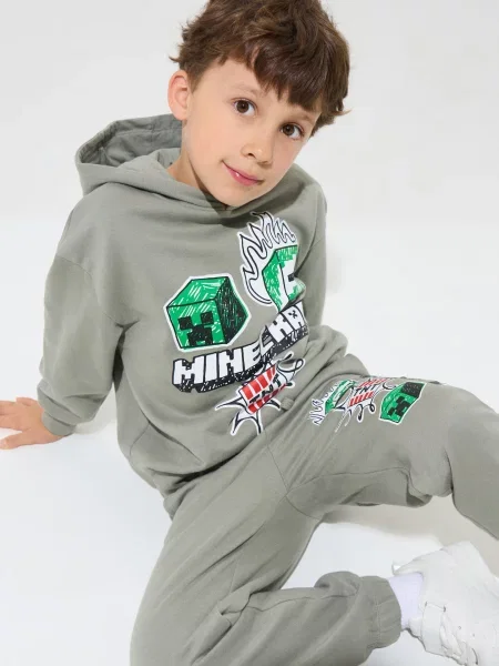 Sinsay Tepláky loose jogger Minecraft hnědá