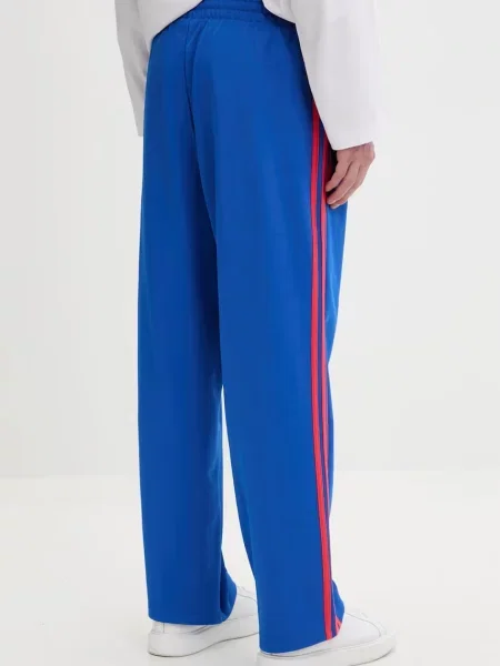 Adidas Originals spodnie dresowe z bawełną niebieski