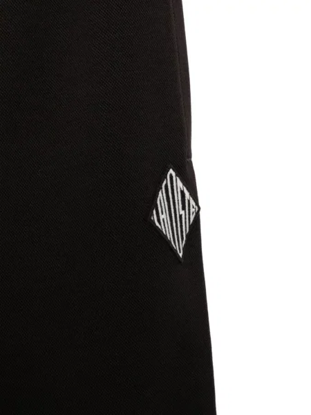 Běžecké kalhoty Lacoste s autogramem černé