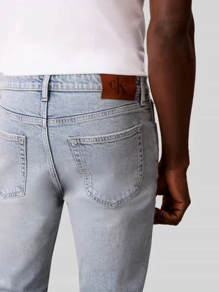 Jeansy o kroju tapered fit z czystej bawełny Calvin Klein Jeans