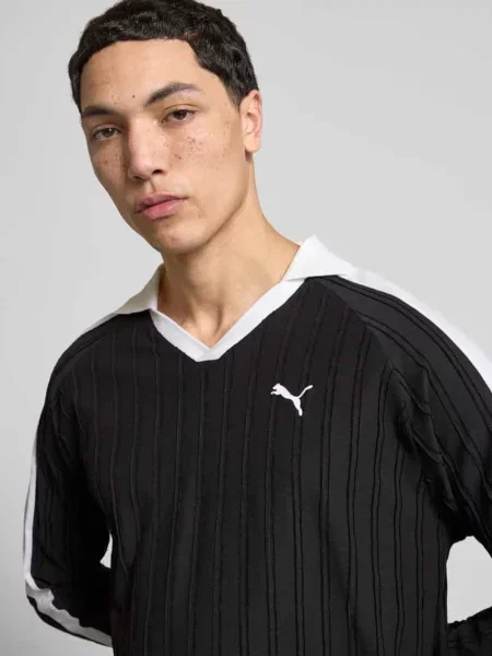 Bluzka z długim rękawem polo o kroju relaxed fit z wyhaftowanym logo Puma Performance czarne