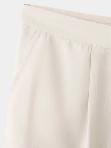 Lejące spodnie wide leg z zakładkami Teen XS MANGO TEEN beżowy