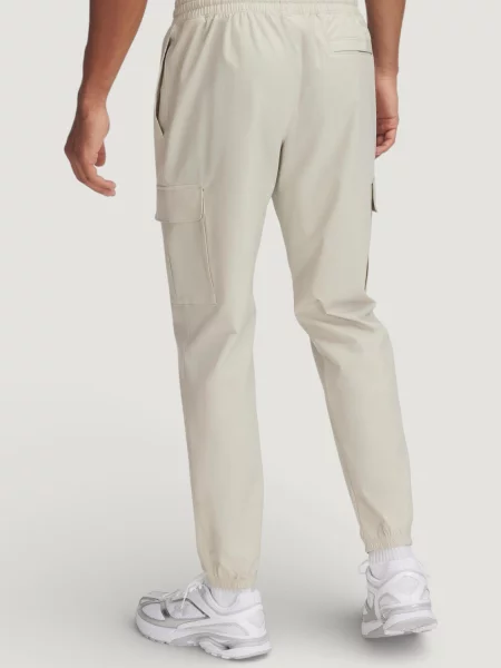 Spodnie Mężczyzna UNDER ARMOUR UA VIBE WOVEN CARGO PANTS beżowe
