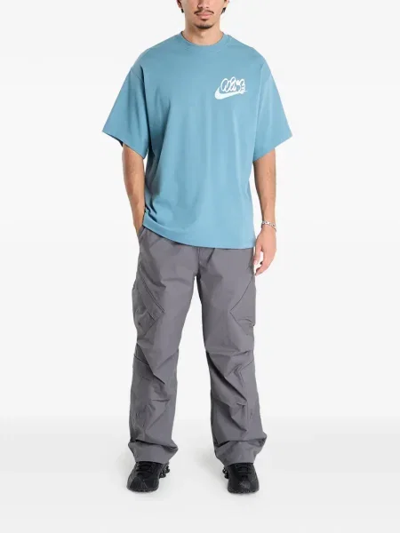 Top sportowy Nike prążkowany niebieski