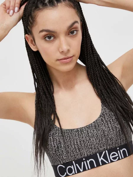 Biustonosz treningowy Calvin Klein Medium Support shocking print czarny