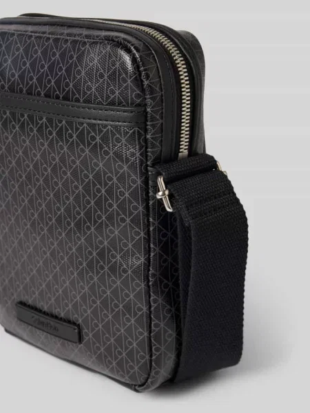 Calvin Klein Saszetka Emblem Aop Coated Slim Reporter czarny
