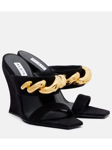 Papuci tip mules Alaïa din piele de căprioară cu pană negru