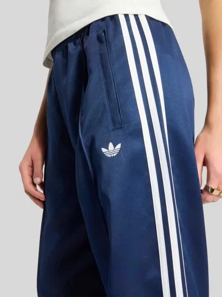 Satynowe spodnie dresowe Adidas Originals z elastyczną talią granatowe