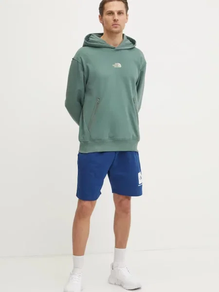 Bombažen pulover The North Face Heritage Relaxed s kapuco zelena
