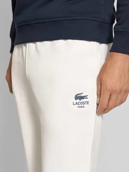 Spodnie dresowe o kroju tapered z czystej bawełny Lacoste biały