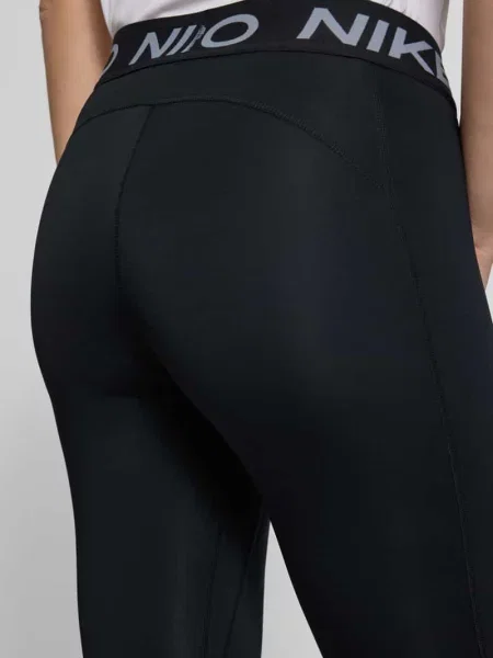 Legginsy z logo i elastycznym pasem Nike Training czarne