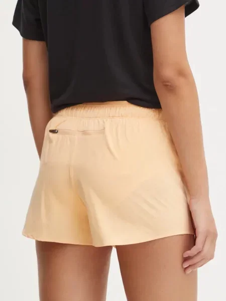 Olcsóbban. Női rövidnadrág New Balance RC Seamless 3" barackvirágos női rövidnadrág. Méret: M narancsszínű