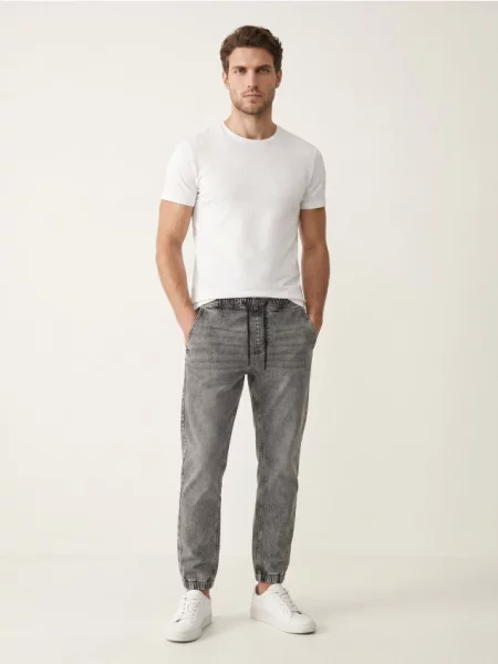 Sinsay Slim fit jogger džíny s efektem vyprání šedá