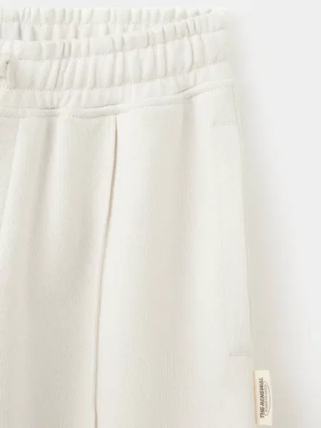 Spodnie jogger o kroju barrel fit kremowy / écru Dzieci 6 MANGO KIDS