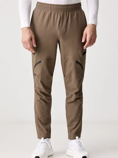 Under Armour tepláky Unstoppable zelené