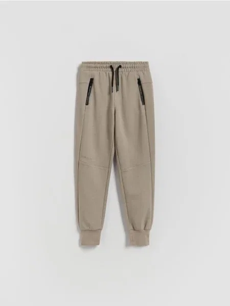 Reserved Pantaloni jogger din bej
