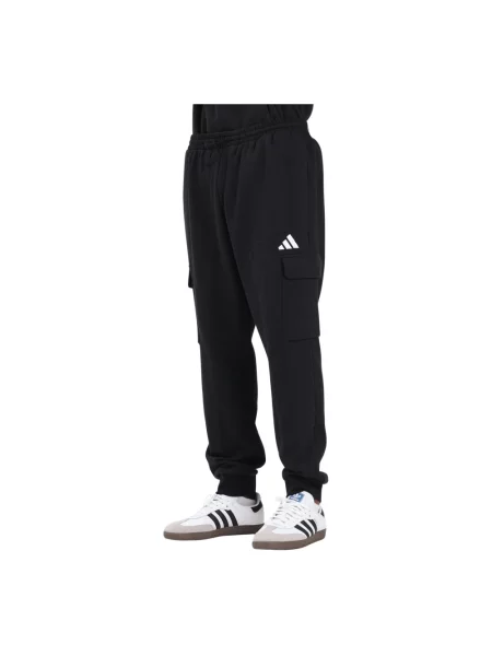 Spodnie dresowe z cargo adidas Essentials Feelcozy Fleece białe
