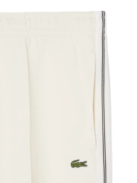 Pruhované běžecké kalhoty Lacoste