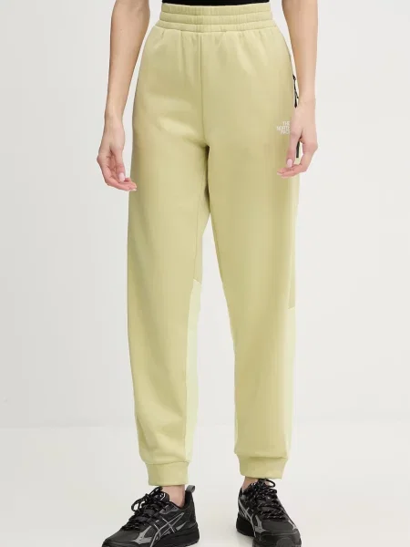 The North Face pantaloni de trening MOUNTAIN ATHLETICS galben