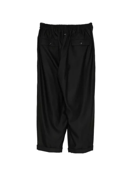 Pantaloni Mastermind World de lână negru