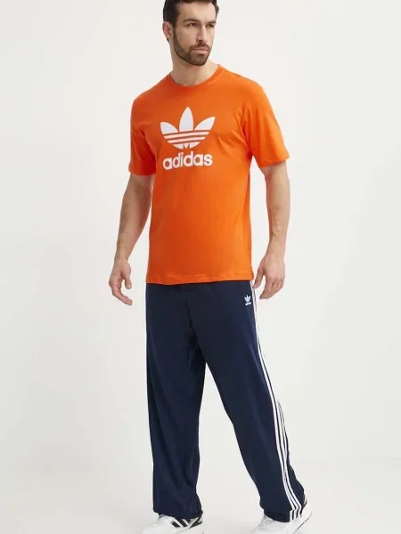 Adidas Teplákové kalhoty adicolor Classics Firebird Tmavomodrá