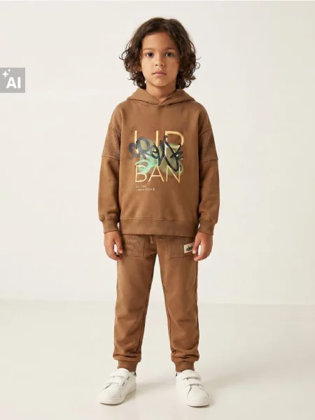 Sinsay kalhoty Jogger hnědá