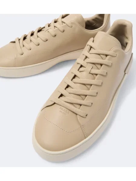 Sneakerși Prada din piele bej